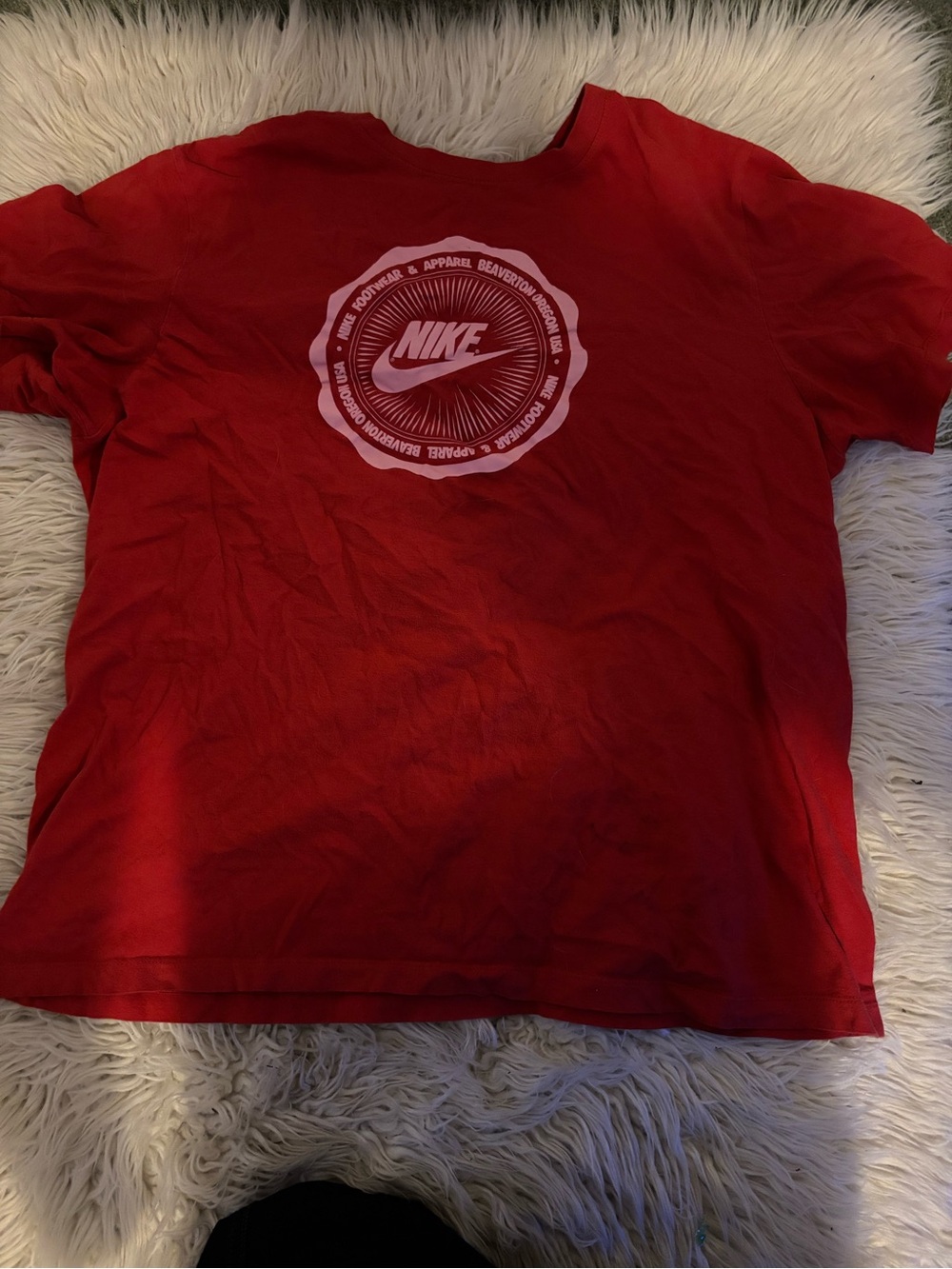 Red nike shirt with circle logo